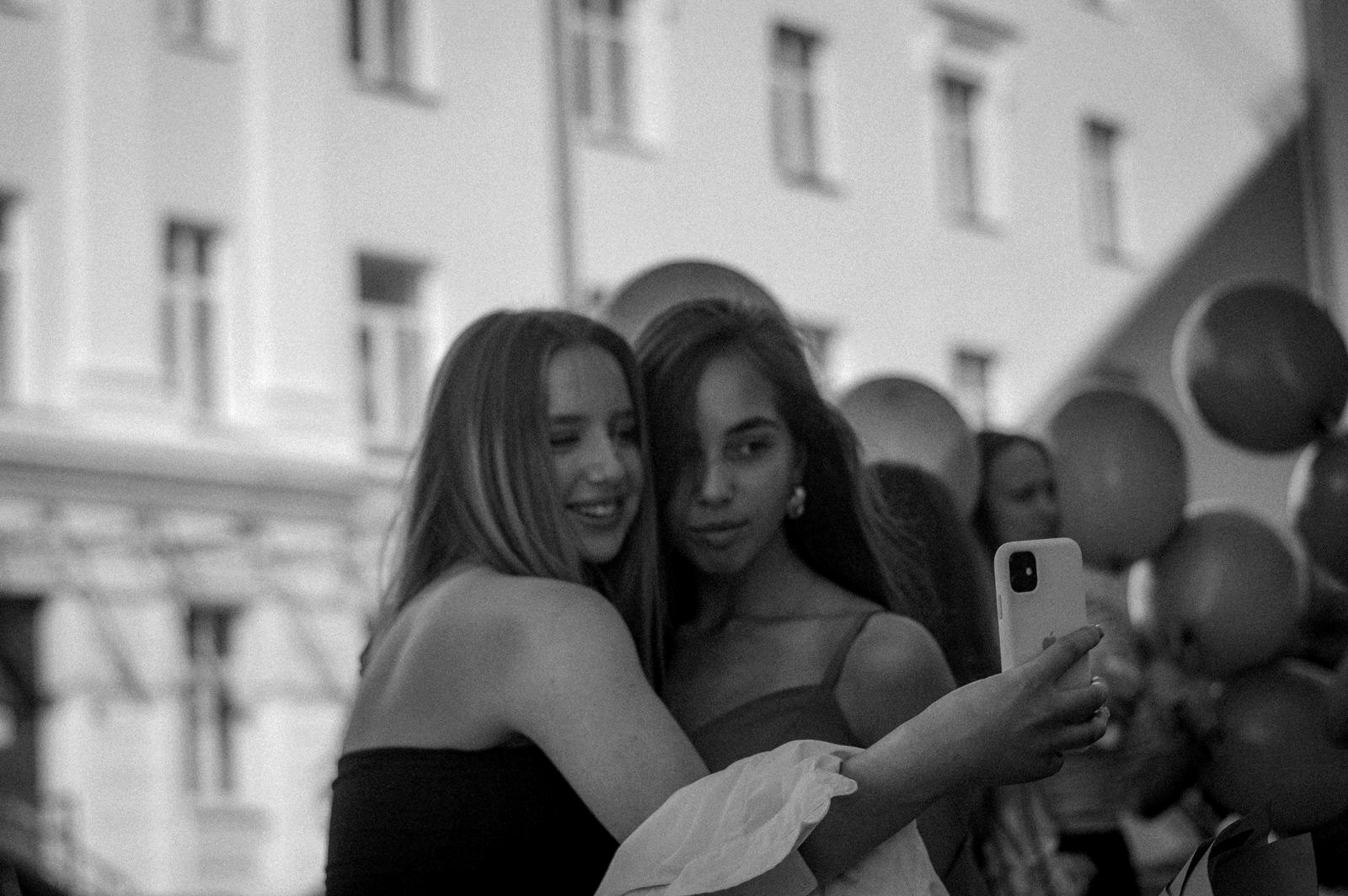 Two guests posing cheek to cheek