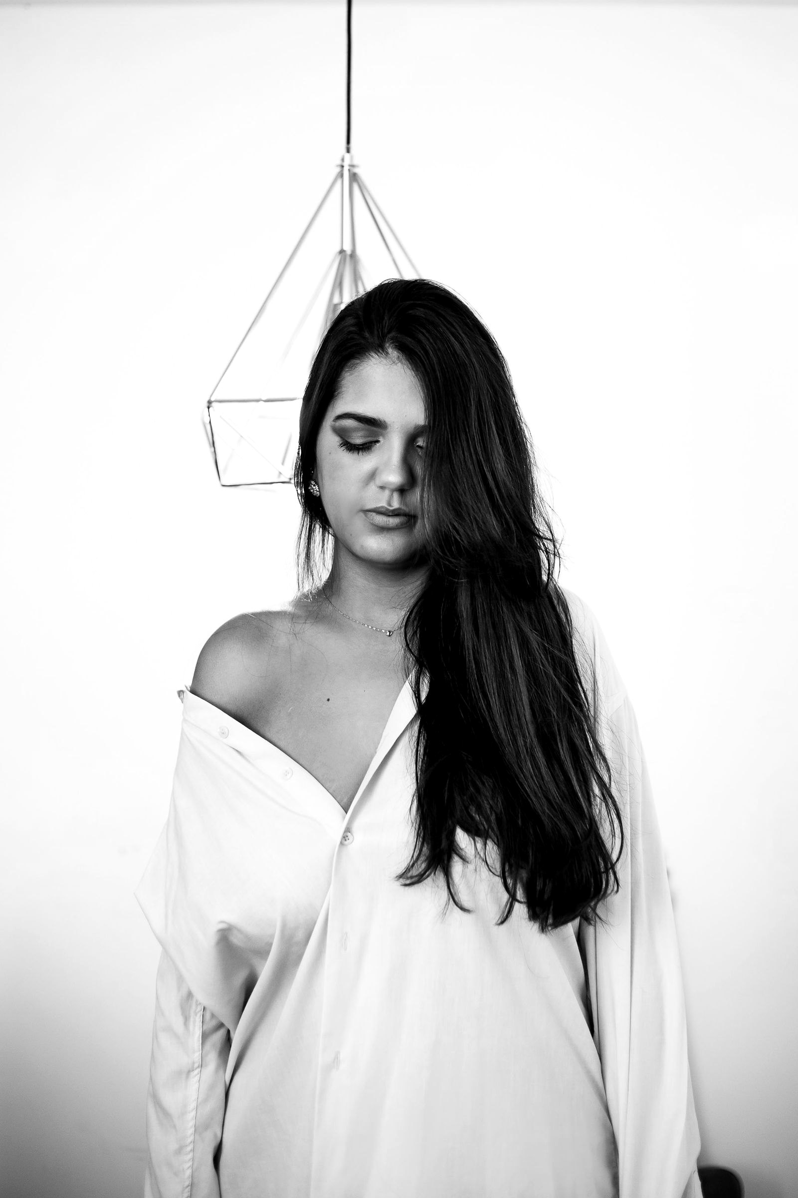 A guest in an off-the-shoulder dress posing for a portrait