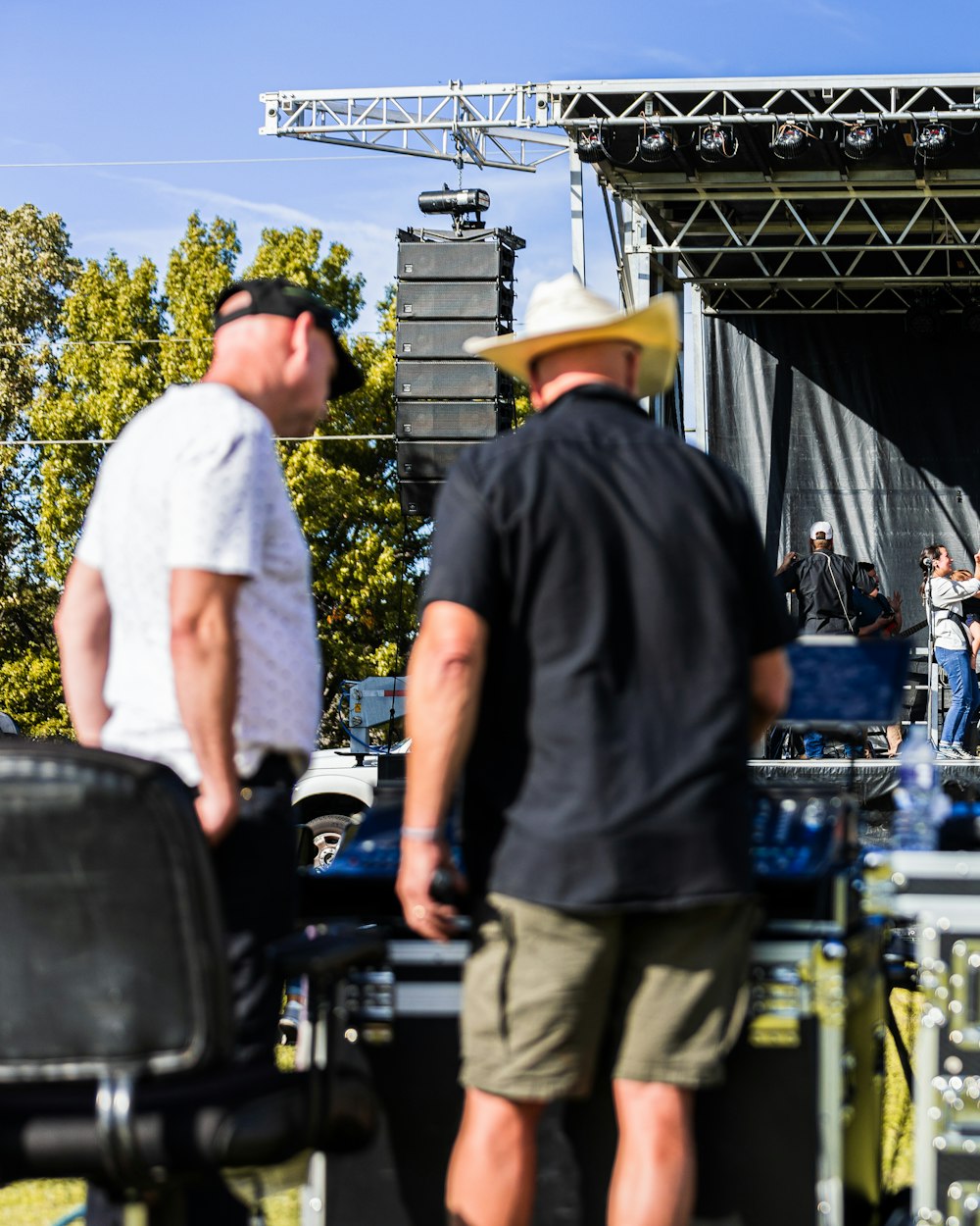 Crew setting up an outdoor stage