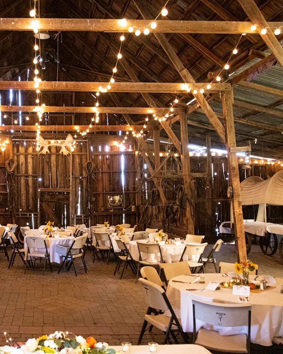Barn wedding reception under string lights
